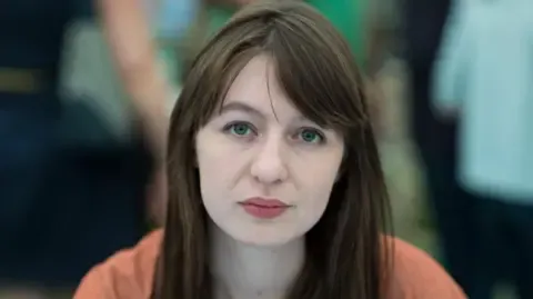 Sally Rooney claims she will not visit the UK because of legal concerns